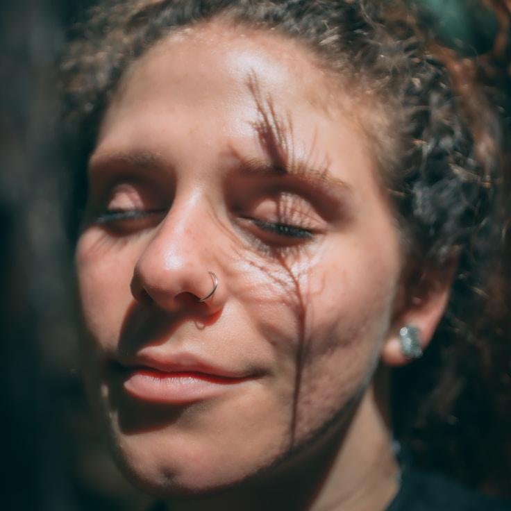 Kaveri Mehta, Lead Design Curator at Meadow Pulse Path, reviewing corporate floral arrangements